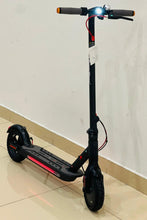 Black electric scooter side view with glowing red rear light and LED deck strip