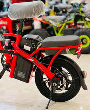 Red folding electric scooter with black seat, front fender, and headlight