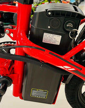 Red electric scooter battery pack housing with label and port area