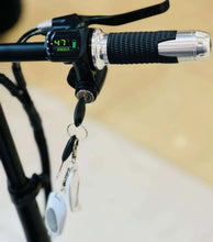 Electric scooter handlebar with digital display, throttle grip, and key ring