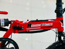 Red electric scooter frame with ROHAN Wings branding and front suspension
