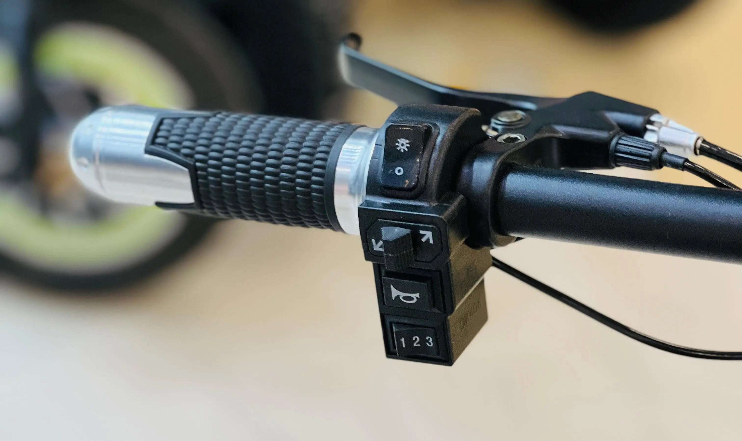 Handlebar controls of RohaN Wings KQ02 electric scooter UAE featuring lights and speed settings