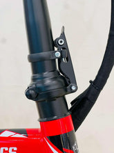 Red and black electric scooter handlebar stem with mounted strap