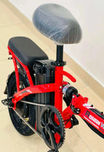 Red folding electric scooter with padded seat cover and front motor housing