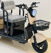 Beige and black electric scooter with cushioned seat, round headlight, and metal basket
