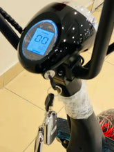 Electric scooter dashboard with blue display and key lock, black handlebars