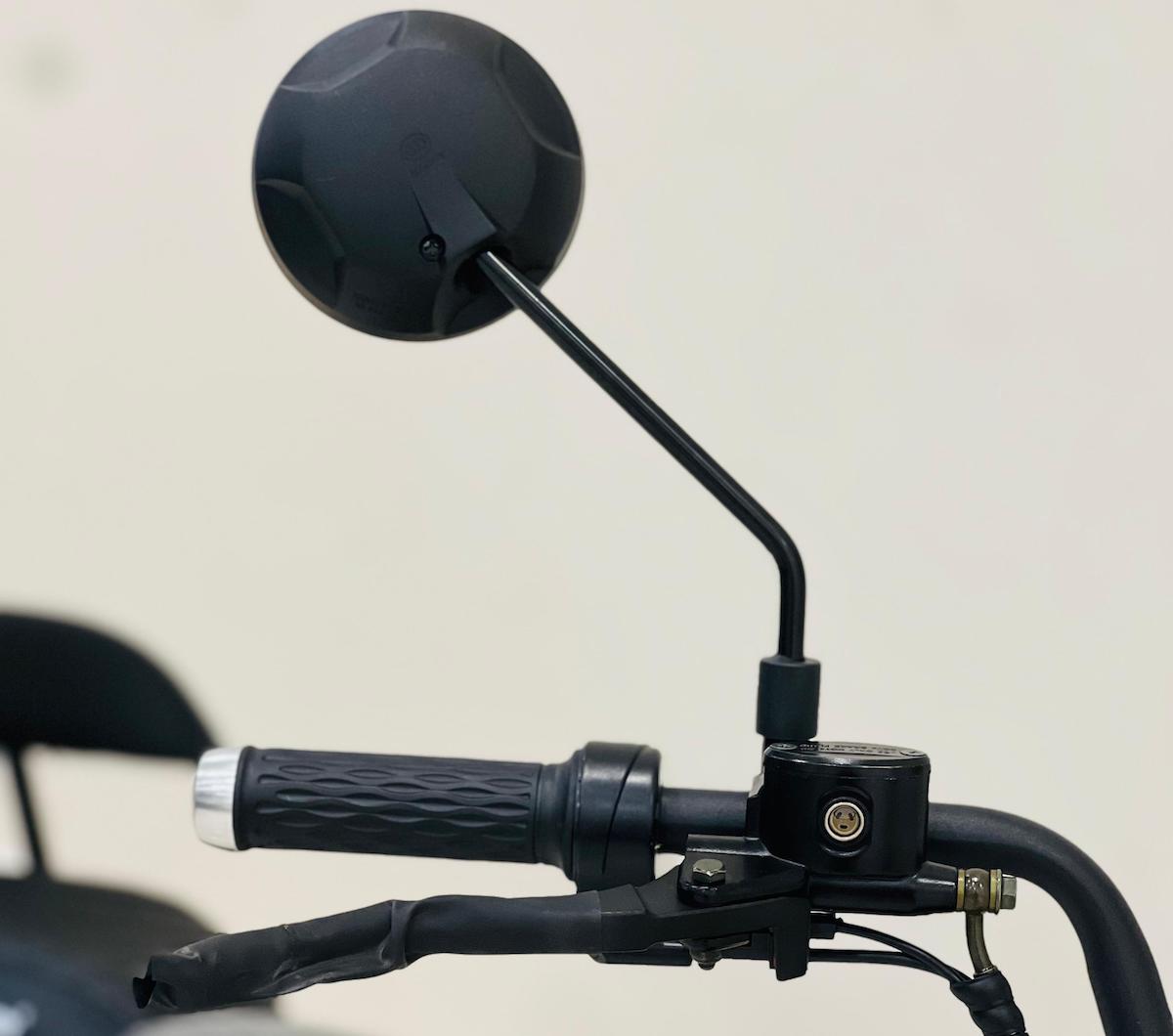 Close-up of RohaN Wings X8 electric scooter UAE handlebar with ergonomic grips and round mirror