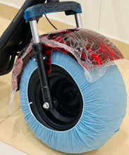 Electric scooter front wheel with black tire and wrapped red wheel cover