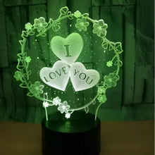 LED heart lamp with three hearts and LOVE YOU text, glowing green on dark base