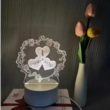 LED heart lamp with three heart petals reading LOVE YOU, inside decorative floral ring