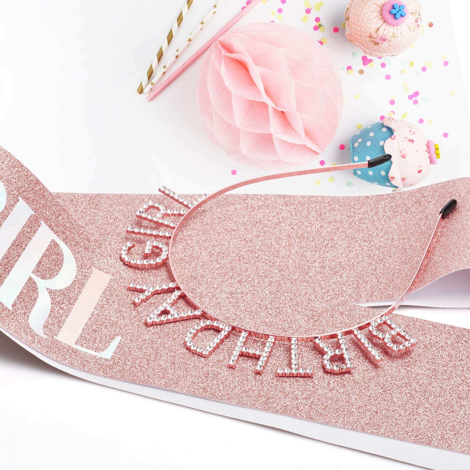 Rose gold birthday crown for women with decorative rhinestone lettering on glittery pink birthday sash