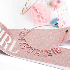 Rose gold birthday crown for women with decorative rhinestone lettering on glittery pink birthday sash