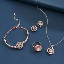 Rose-gold crystal jewelry set with bracelet, ring, pendant necklace, and two stud earrings