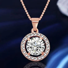 Rose-gold crystal pendant necklace with large round clear center stone