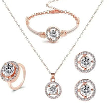 Rose-gold crystal jewelry set: pendant necklace, bracelet, ring, and stud earrings