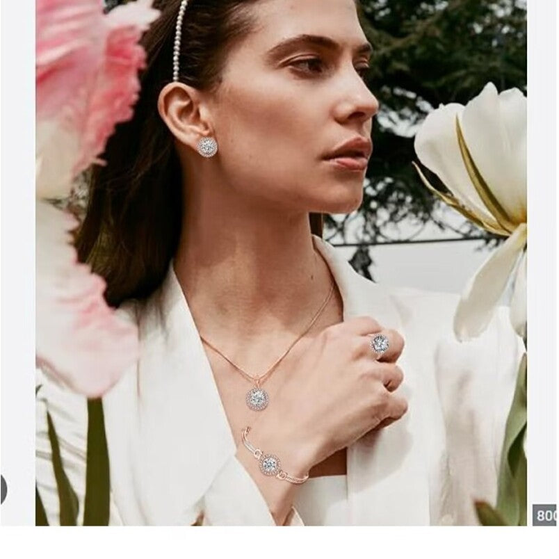 Huitich rose gold crystal jewelry set including earrings necklace bracelet and ring worn by woman