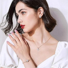Huitich rose gold crystal jewelry set with necklace bracelet and earrings on woman