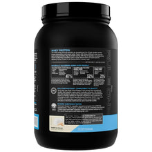Whey protein powder tub back panel with ingredient and directions text.