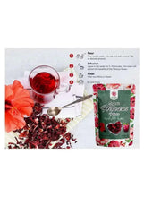 Organic hibiscus flower powder pouch with brewing steps diagram and red tea cup