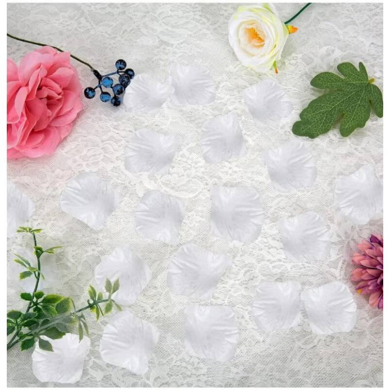 Huitich white artificial rose petals scattered on lace with decorative flowers and leaves