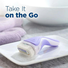 Schick Intuition razor with refill cartridge on wet surface for on-the-go shaving