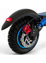 Scooter wheel with off-road tire and inner tube, blue rim and brake disc visible