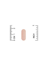 Multivitamin and multimineral supplement tablet, pale pink, shown with size ruler
