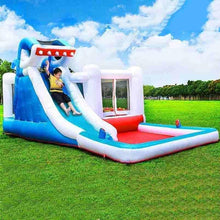 Inflatable shark-themed kids water slide with blue slide, red landing, and white barriers