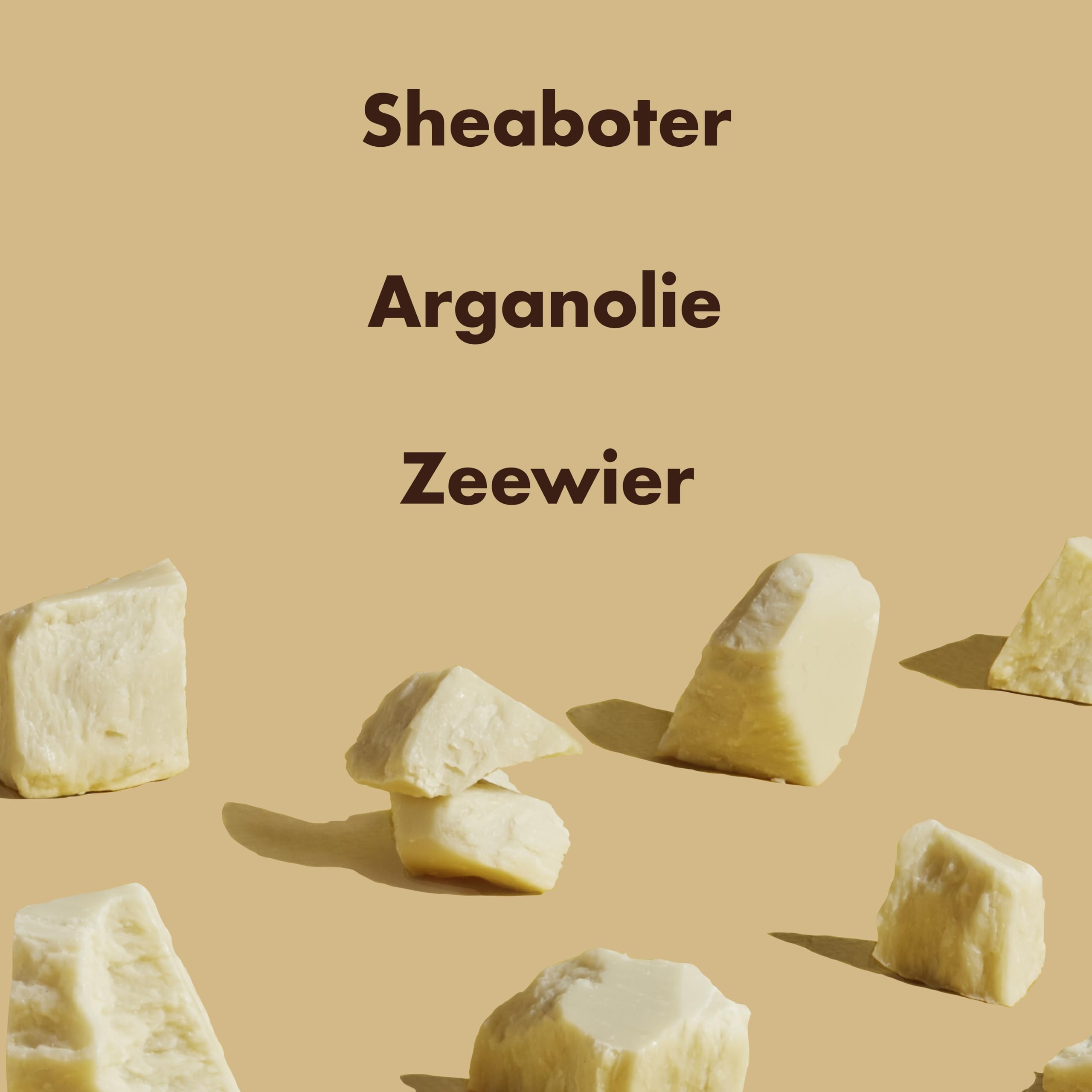 Shea Moisture natural sulfate free shampoo ingredients display with shea butter chunks on beige background