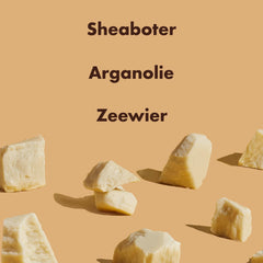 Shea Moisture natural sulfate free shampoo ingredients display with shea butter chunks on beige background