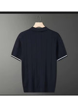 Short-sleeve polo shirt in dark navy with white-trim sleeve cuffs, plain back.