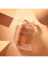 Women’s EDP perfume bottle, tilted view showing Shuhrah label and gold cap