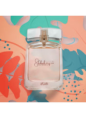 Rasasi Shuhrah perfume for women in an elegant bottle with a floral background