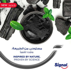 Signal Complete 8 Nature Elements toothpaste smear with charcoal pieces mint leaves and Signal logo