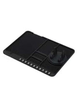 Black silicone dashboard anti-skid mat with numbered slots and raised grip sections
