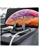 Black silicone dashboard anti-skid mat with textured surface and phone stand opening