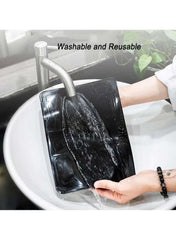 Huitich silicone anti-skid dashboard mat being washed under a faucet for easy cleaning