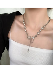 Huitich silver charm statement necklace with star and round charms worn on model's neck