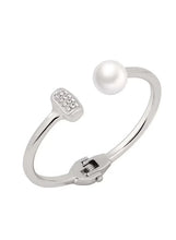 Silver cuff bracelet with round white pearl and crystal-studded square accents