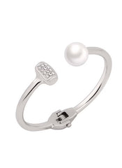 Elegant silver cuff bracelet with pearl and rhinestone accents by Huitich jewelry