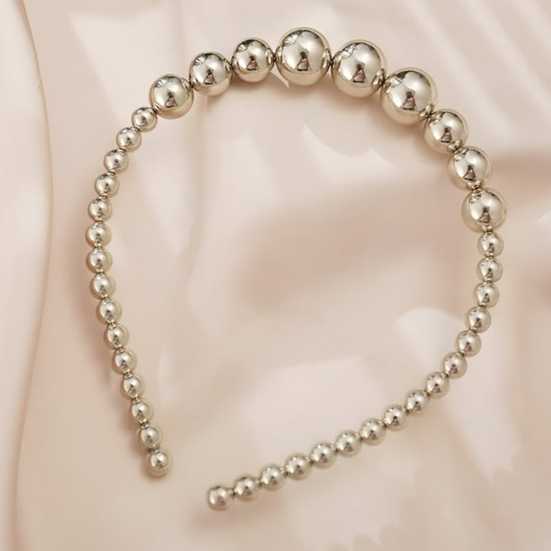 Huitich silver pearl headband for girls featuring graduated silver beads on a flexible band