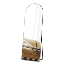 Arched standing mirror with silver frame, side profile view