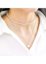 Layered silver tone necklaces with pearl choker and small round pendant