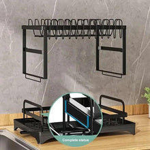 Black sink dish rack with draining base and utensil slots on a mounted frame