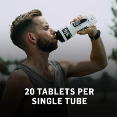 Man drinking from SiS white water bottle with 20 tablets per tube label electrolyte tablets for hydration
