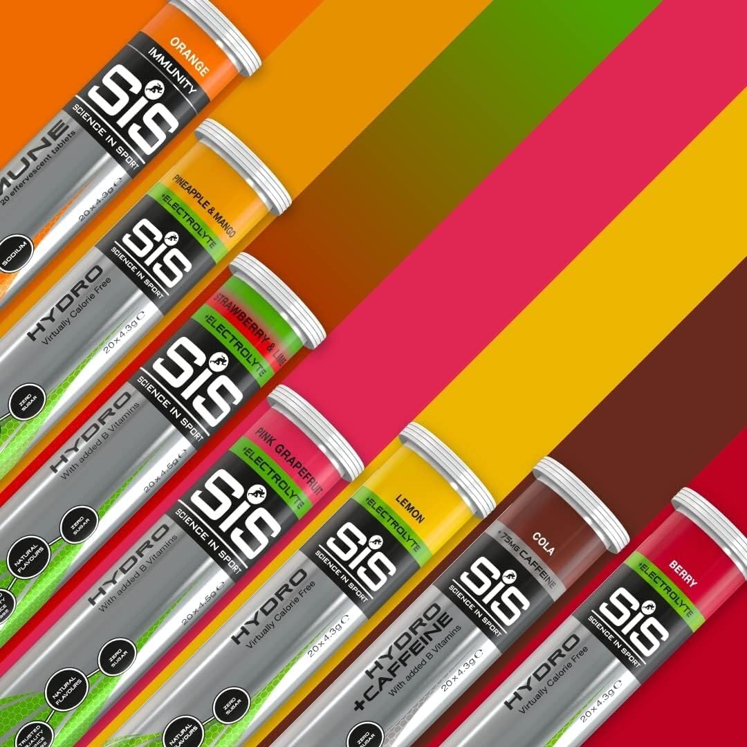 Science in Sport electrolyte tablets for hydration assorted flavor tubes arranged diagonally on colorful background