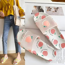 White slide sandals with peach pattern, wide strap, open toe