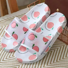 Pair of white peach-print slip-on sandals with open toe and front strap