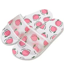 White slip-on sandals with peach fruit print, open toe and padded strap