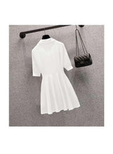 White short-sleeve top with waist belt and flared skirt